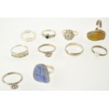 A collection of ten dress rings, three with silver hallmarks,