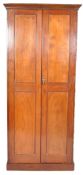 An early 20th century mahogany solid door library bookcase cabinet having large panelled doors