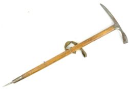 A WWII Second World War period Stubai Austrian ice axe having a steel axe head, wooden handle,