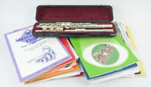 A cased Boosey & Hawkes flute,