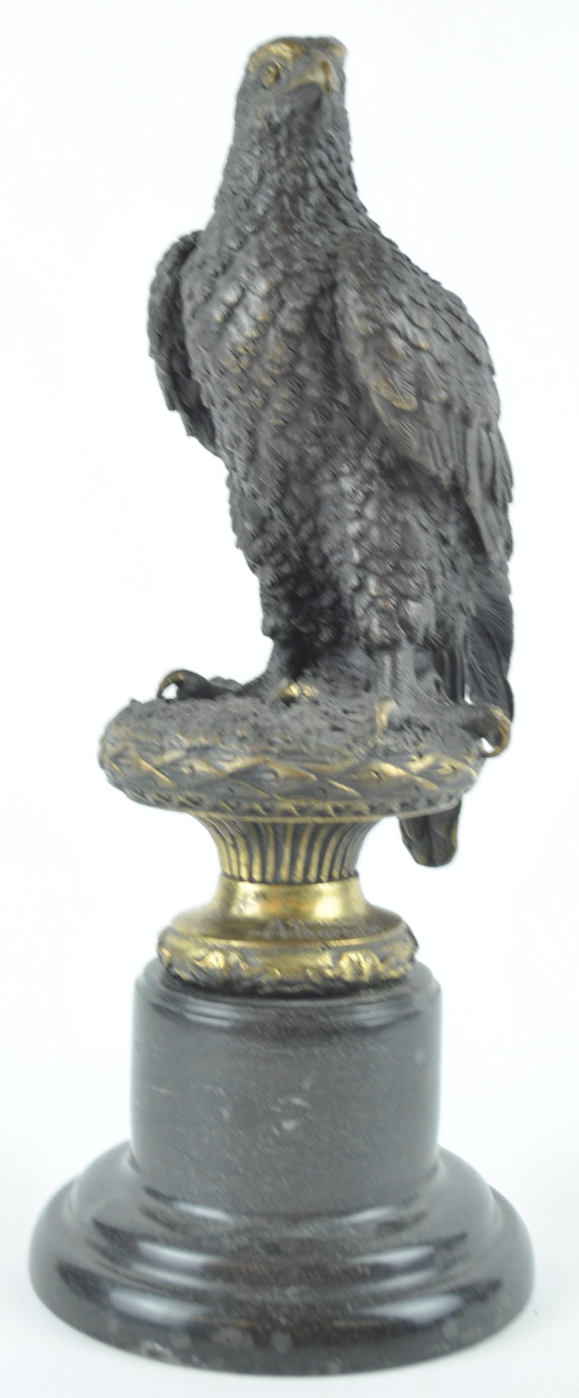 A bronze eagle on black marble plinth, after Archibald Thorburn, with indistinct foundry mark,