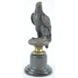 A bronze eagle on black marble plinth, after Archibald Thorburn, with indistinct foundry mark,