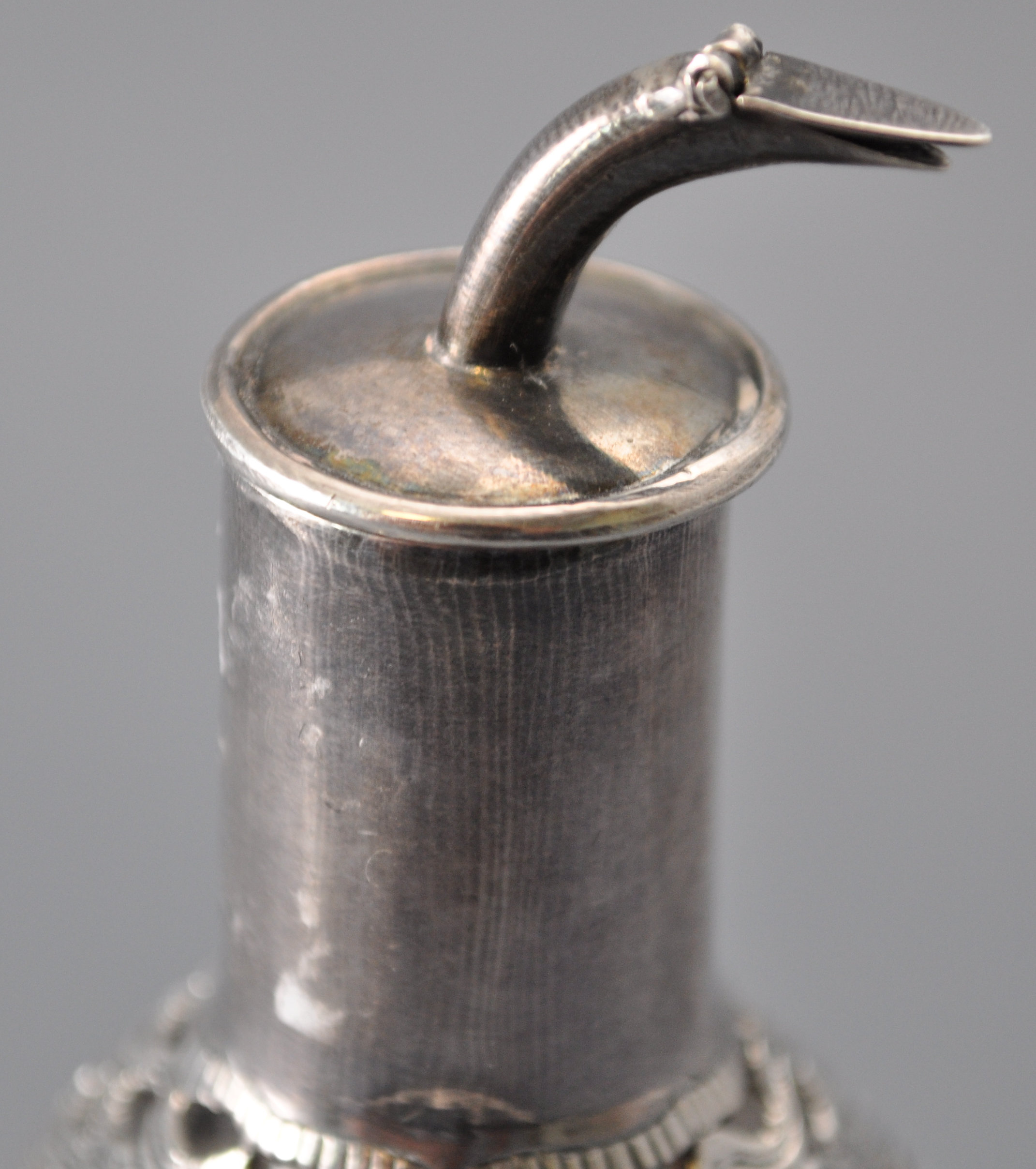 An Asian glass bitters bottle of dimpled triangular form, overlaid in a white metal sleeve, - Image 4 of 5