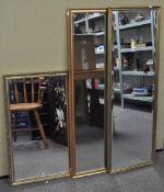Three gilt framed wall mirrors