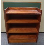 A folding card table and a mahogany bookcase