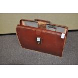 A brief case, coins,