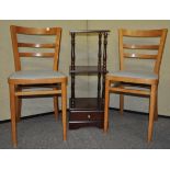 Two chairs and a shelf unit