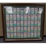 A group of framed cigarette card style rugby cards