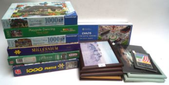 A quantity of jigsaws and frames