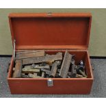 A tool chest containing a quantity of wood planes