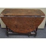 An 18th century elm gate leg table