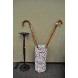 An umbrella stand and walking stick