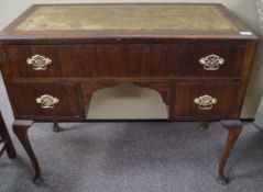 A mahogany leather top desk