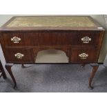 A mahogany leather top desk