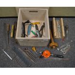 A wooden box with lid and sundry tools