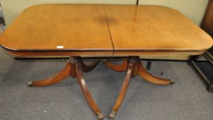 A Regency style dining table with one loose leaf