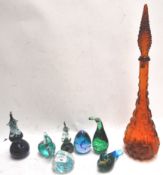 A collection of glass animals and other glass