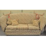 An upholstered drop side sofa