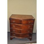 A mahogany serpentine chest