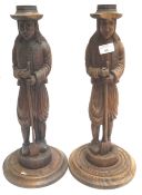 A pair of carved figures,