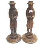 A pair of carved figures,