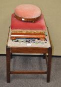 A mahogany stool with tapestry inset seat and two footstools
