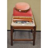 A mahogany stool with tapestry inset seat and two footstools