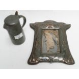 An Art Nouveau style pewter water jug and an Art Nouveau style frame