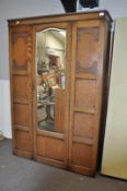 An oak mirror door wardrobe