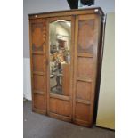 An oak mirror door wardrobe