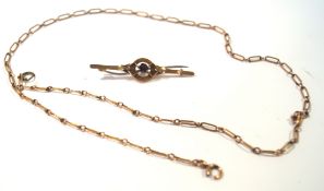 A yellow metal chain, the catch marked 9ct and a similar marked bar brooch with a base metal pin,