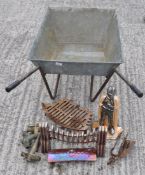 A metal wheelbarrow and other metalware