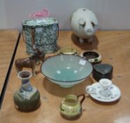 A stoneware piggy bank and other items