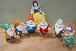 A collection of Disney china figures, to include Snow White and six dwarves,