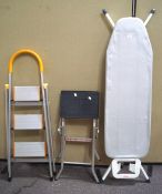 Two step ladders and an ironing board