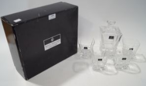 A boxed Doulton whisky decanter and glass set