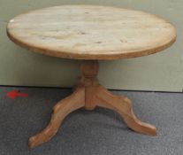 A tilt top pine table