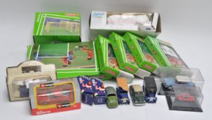 A group of model cars and other items