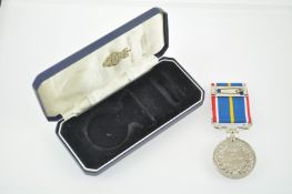 A 1939-60 ER II Service medal 32.
