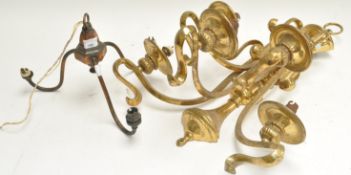 A brass wall light and a three branch ceiling light