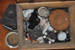 A pine box containing binoculars and other items