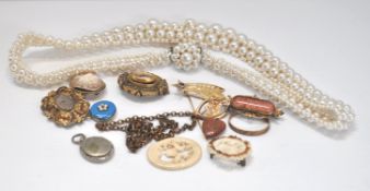 A tin of antique jewellery