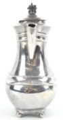 A silver plated coffee pot of shaped bulbous rectangular form,