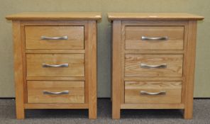 A pair of bedside chests of drawers