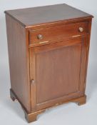 A mahogany side cabinet with one vertical hinged cupboard above a panelled door on bracket feet,