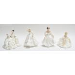 A collection of four Royal Doulton figures of ladies