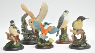 Four Country Artist bird figures and one other