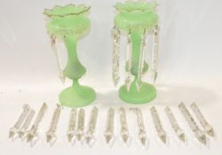 A pair of Victorian green glass table lustres