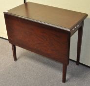 A Stag mahogany swivel top table