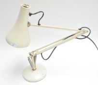 A white anglepoise lamp